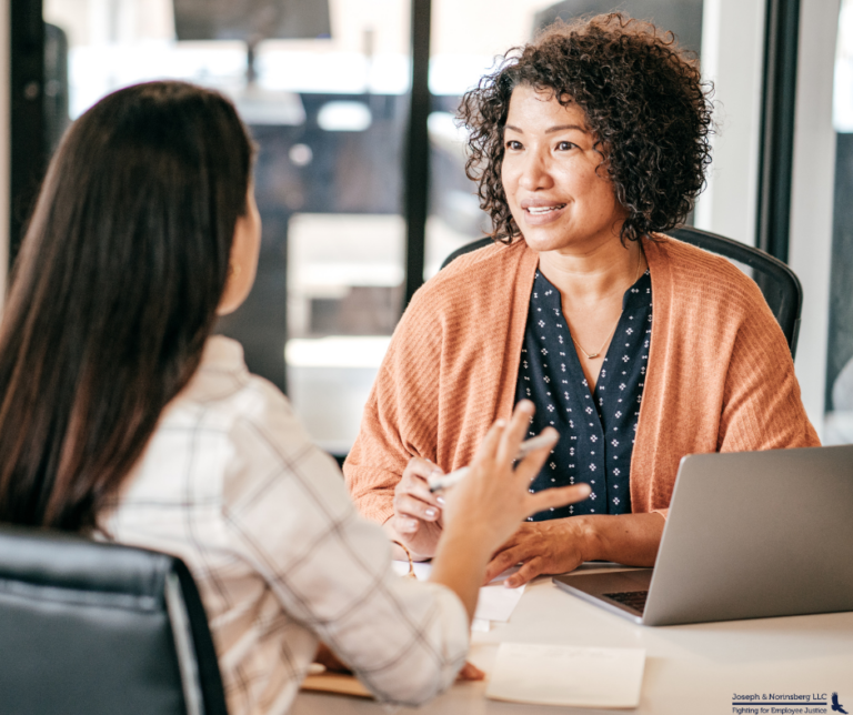 A manager having a conversation with her employee