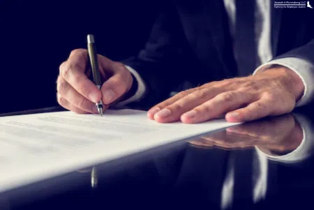 A lawyer signing important documents