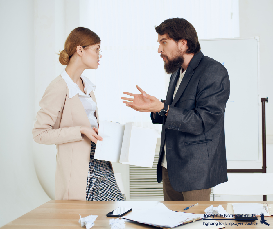 Two employees arguing in an office