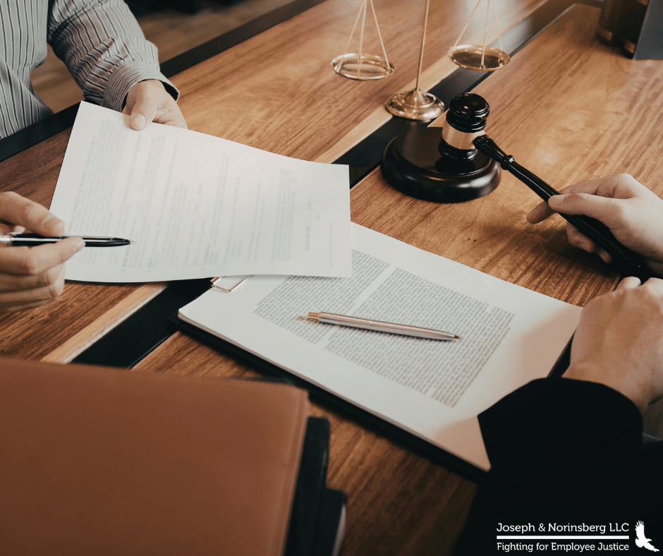 Close up of two individuals reviewing paperwork