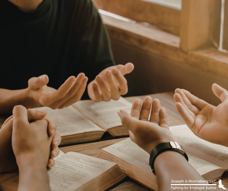 Close up of people with their palms facing up as if in prayer